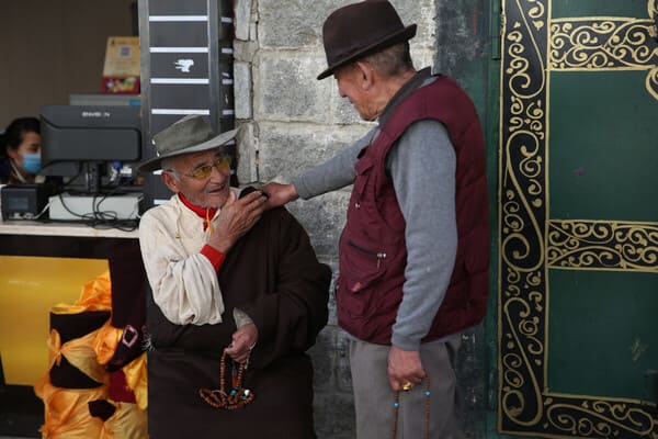 Tibetans greeting each other on the street